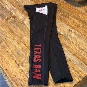 Pink official collegiate athletic leggings.